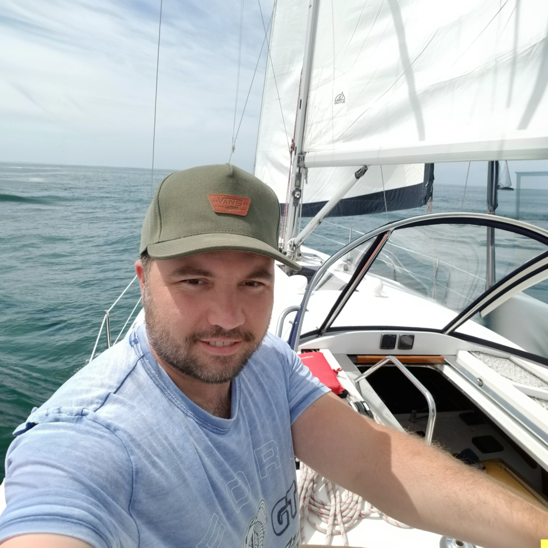 John Partridge on a sailboat